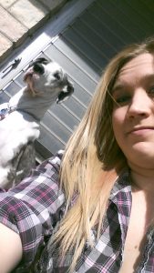 Amanda Kinnunen is pictured with her dog for the infamous A-T "dog-selfie"
