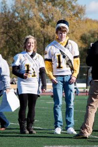 Barbara Bass and Trenton Coleman accepting their crowns during the Homecoming game.