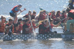 Teams of 20 rowers compete for first place at the 10th Annual Oshkosh Community Dragon Boat Race and Festival. 