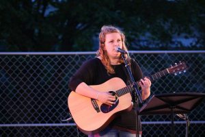 UW Oshkosh student Kelsey Johnson-Fisher sings and plays.