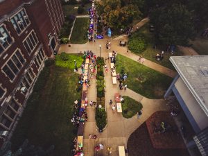 An aerial photo shows UW Oshkosh students enjoying Taste of Oshkosh and all the clubs offered at the University.