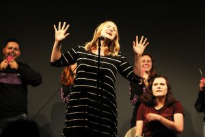 UW Oshkosh student sings in the Homecoming talent show. This is one of many activities that is happening this week.