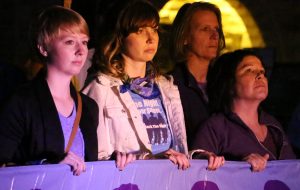 A group of participants look on during the Fox Valley Take Back the Night event at UW Oshkosh. 