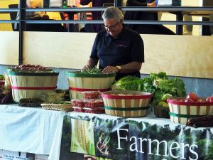 Chuck Malkowski sold produce for Loffredo Fresh Produce at the third annual UWO Farmers Market. Students purchased fruit, baked goods and more in Reeve Memorial Union. 