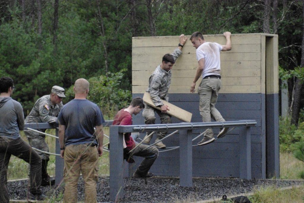 UW Oshkosh ROTC students work together to complete the group obstacle. Future officers participate in training with fellow ROTC members to enhance and hone their skills everyday.