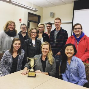 Dr. Sara Steffes-Hansen receives her faculty adviser of the year award with PRSSA members. Steffes-Hansen was the only faculty adviser in the nation to receive this award.