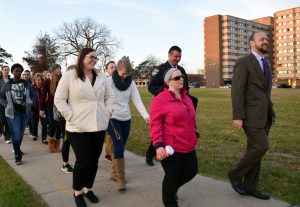 Chancellor Andrew Leavitt leads students in the Safety Walk across campus. Concerns with unsafe locations around UWO were brought up. 