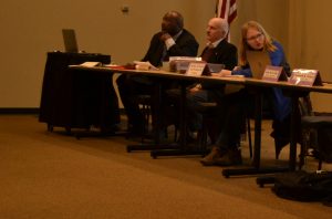 Darryl Sims, Alan Crist and Kaitlyn Cartwright take part in the panel to discuss the search for a new vice chancellor of student affairs on Monday evening.