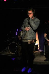 Lead singer, Nick Heath of Milwaukee-based band American Bandit performs alongside band members for a crowd of students at the event hosted by Reeve Union Board.