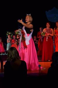 Fochs responds to the crowd after winning the pageant. Fochs founded the organization Operation Not Alone, which helps with soldiers and veterans.