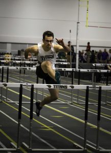 John Puffer clears a hurdle during the Titan Challenge.