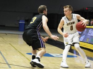 Guard Charlie Noone looks to move the ball around against UW-Stevens Point on Feb. 1. Noone averages 13.1 PPG. 