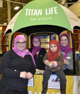 From left to right: Alicia Johnson, Brooke Aldersebaes, Amera and Juliana Kahrs stand pose together after being taught to wear the hijab.