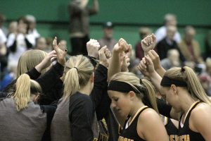 The University of Wisconsin Oshkosh women’s basketball team huddles prior to the start of the NCAA Division III Sweet 16 game.