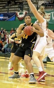 Sophomore forward Isabella Samuels (No. 44) fights her way to the basket, past Washington University’s Jenn Dynis (No. 23).