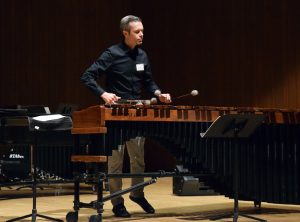 Brian Baldauff performs Urban Sky Glow on marimba while integrating electronic background sounds.