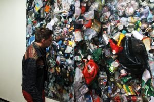 Christian Anderson, a local Oshkosh Art gallery owner, examines “Tip Floor.”