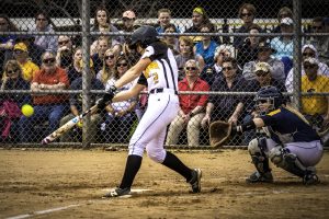 No. 2 Abby Menting hits the ball against UW Eau Claire on April 9. The Titans swept the Blugolds 2-0.