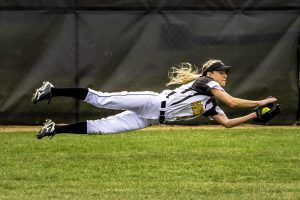 Junior outfielder Caitlin Hoerning lays out to catch a ball during the recent homestand. Hoerning currently holds a .306 batting average, with one home run and nine RBIs.