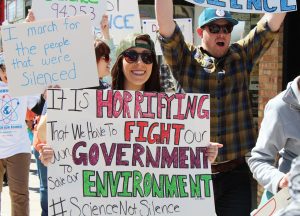 Marchers take to the streets of Oshkosh to raise awareness of the defunding of science. Participants chanted to show their support for science on Earth Day.