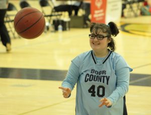 A Door County athlete passes the ball to a teammate during the 41st Annual Special Olympic games held at Kolf Sports Center.