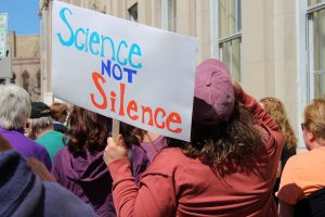 Marchers gather to walk down the streets of downtown Oshkosh on April 22 as part of Earth Day.