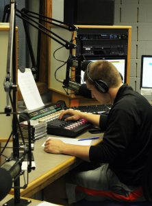 Junior communications major Brandon Beier DJs during the 90.3 WRST FM open house event Friday afternoon.