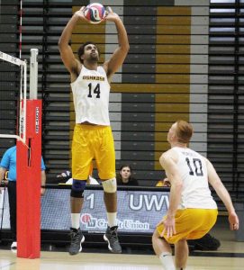 Senior setter, No. 14 Travis Hudson sets the ball to No. 10 Peter Nordel during his last home-court game on Tuesday.