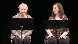 Anna Schiferl, as Amber, and Sara Neumann, as Karen and Beth, read Hannah Clark’s play “Icarus.”