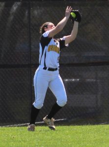Claire Petrus catches a fly ball in the outfield against UWW.