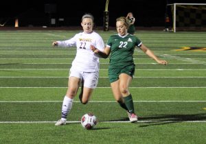 Freshman forward Delaney Karl heads the ball against the Maroons. Karl has taken four shots this season and has started in three games this year.