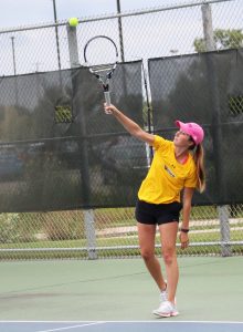 Senior Hannah Nauth serves up a ball in the Hope College Invitational on Sept. 15 and 16.