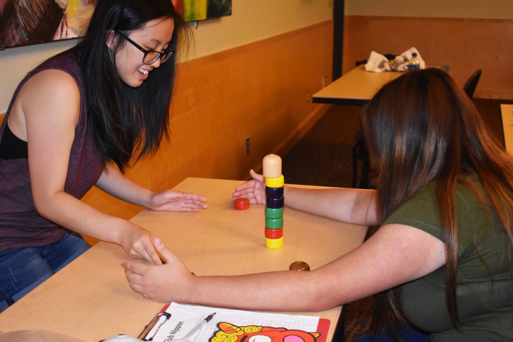 Students laugh while playing traditional Japanese games while attending Club Nippon Game Night on September 26th. 