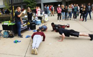 Students compete in a push-up contest hosted by the Student Recreation and Wellness Center.