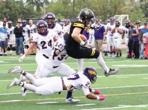UWO senior wide receiver Chad Redmer hurdles a defender on his way to yards after the catch against UWSP Saturday.
