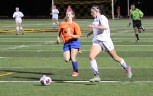 Freshman Mallory Knight (No. 6) advances the ball down the field past a Platteville defender on Saturday.