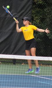 Sophomore Lesley Kutnink returns the ball on Thursday against UWSP. 