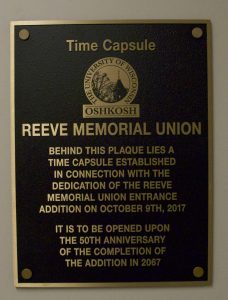 The Time Capsule sits behind this plaque in the new addition of Reeve Memorial Union. Included in the time capsule are 2017 mementos such as fidget spinners and PopSockets. In addition, there is a letter from current Chancellor Andrew Leavitt to the future chancellor of UWO. Campus Life Executive Director Jean Kwaterski said she hopes students return in 2067 to see it opened.