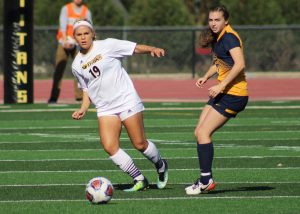 UW Oshkosh senior defender Felicia Retrum addresses the ball on Saturday. In her career, Retrum has nine total points.