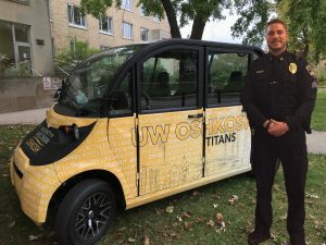 The UWOPD Saferide vehicle sits outside of Radford Hall with Police Sergeant Chance Duenkel.