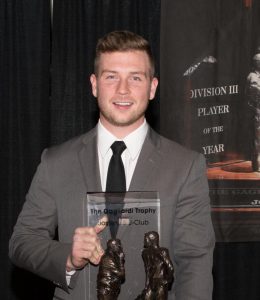 Brett Kasper poses at the Gagliardi award ceremony where he received the 2017 Gagliardi Trophy. This award is given out to the player who excels in academics, athletics and community service in the Division III level. Kasper was announced the winner of this award after beating out three other finalists, one of which was from UW-La Crosse. He is the first player in UW Oshkosh football history to win this award.