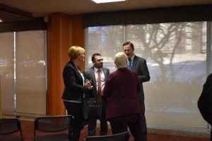 Acar (back left) talking with assistant professor in the criminal justice department Durmus Camlibel (back right), Chief of Staff Kate McQuillan (front left) and Criminal Justice Professor Victoria Back (front right).