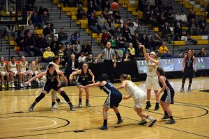 UW Oshkosh junior forward Melanie Schneider releases a free throw as freshman Karsyn Rueth (left) and senior Madeline Staples (No. 32) move off the block to gain position for a potential rebound. In the regular season finale against UW-Stout, Schneider had five points.