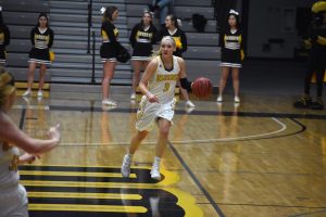 Senior guard Jaimee Pitt moves the ball up the court and looks to pass.