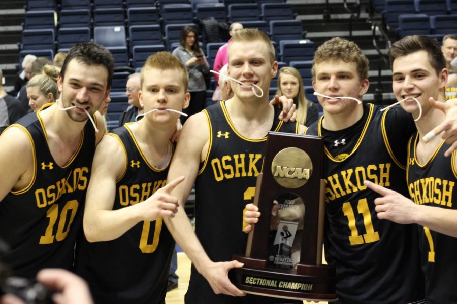 Members+of+the+UWO+men%E2%80%99s+basketball+team+poses+for+a+photo+after+defeating+Augustana+College+on+March+10.+This+victory+marked+the+24th+win+of+the+season+and+the+first+time+in+the+program%E2%80%99s+history+that+the+squad+earned+a+berth+in+the+Final+Four.+