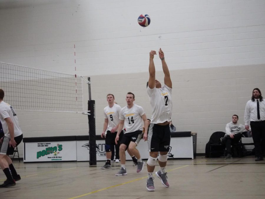 Senior libero/defensive specialist Samuel Moua returns the ball with a reverse bump against the UW-Whitewater Warhawks on March 8.