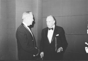  Former UW Oshkosh Chancellor Roger Guiles (left) speaks with Fredric March (right).