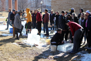 UWO students gather around ice sculptures to discuss their favorite and least favorite designs.