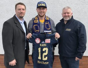 Former UW Oshkosh Titans starting quarterback Brett Kasper poses with Rams’ head coach Salimir Mehanovic (left) and offensive coordinator Erwin Rieger (right) after signing a professional contract with the team last week. This past season, Kasper threw for a career-high 3,205 yards and 34 TD’s and only six INTs, leading Oshkosh to an undefeated regular season.   