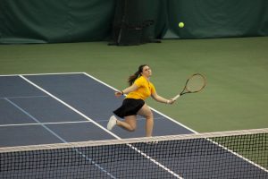 Sophomore Samantha Koppa lunges to return a ball during Sunday’s match against Carthage College in Neenah. So far on the season, Koppa has a record of 11 wins and 8 losses in singles play, while she has earned 8 wins in doubles matches.